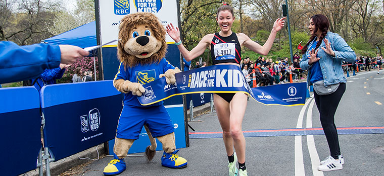 Runner cheering crossing the finish line  