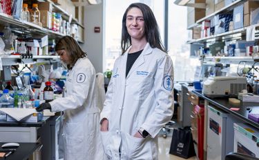 MSK researcher Dr. Mara Sherman standing in an MSK lab. 